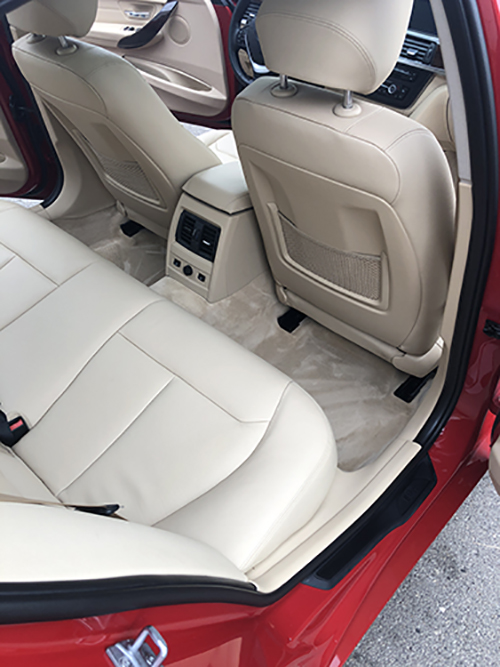 Red BMW interior with glossy detailed seats.