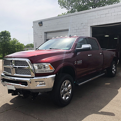 Maroon truck with deluxe exterior detail.